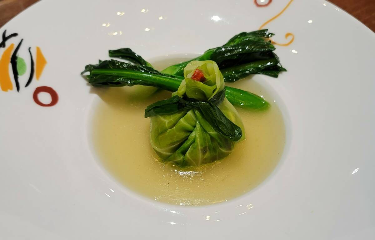 A vegan treasure satchel, with a spinach wrapper and vegetable filling, is on the Chinese New Y ...