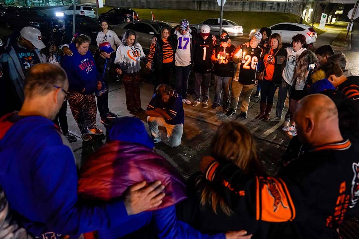 Fans gather outside of University of Cincinnati Medical Center, late Monday, Jan. 2, 2023, in C ...