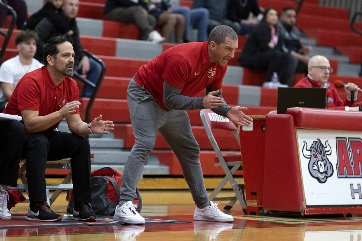 Arbor View assistant coach Mark Dickel shouts from the sidelines during a boys high school bask ...