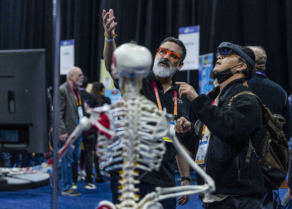Arnaud Destainville guides Jung Soon Han through a virtual Arbys Medical system during the CES ...