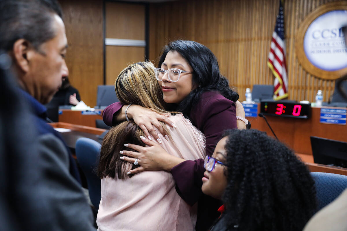 School Board Trustee Brenda Zamora hugs her mom Mirna Guigui after a special meeting where she ...