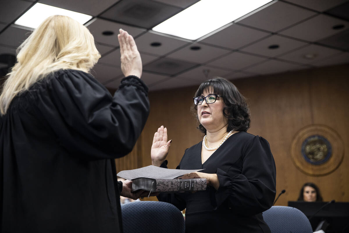 Las Vegas Justice Court Judge Melissa Saragosa swears in Irene Bustamante Adams, newly elected ...