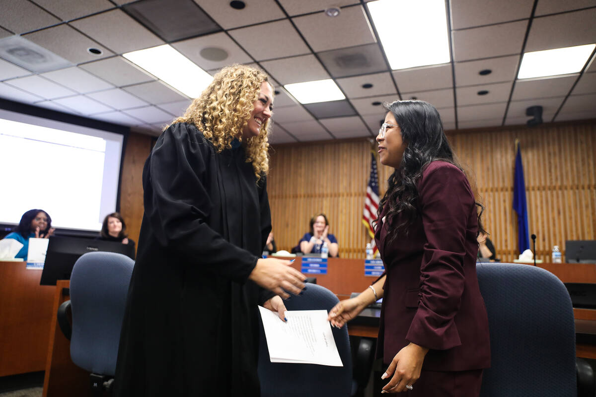 Clark County District Court Judge Carli Kierny goes in to hug Brenda Zamora, newly elected scho ...