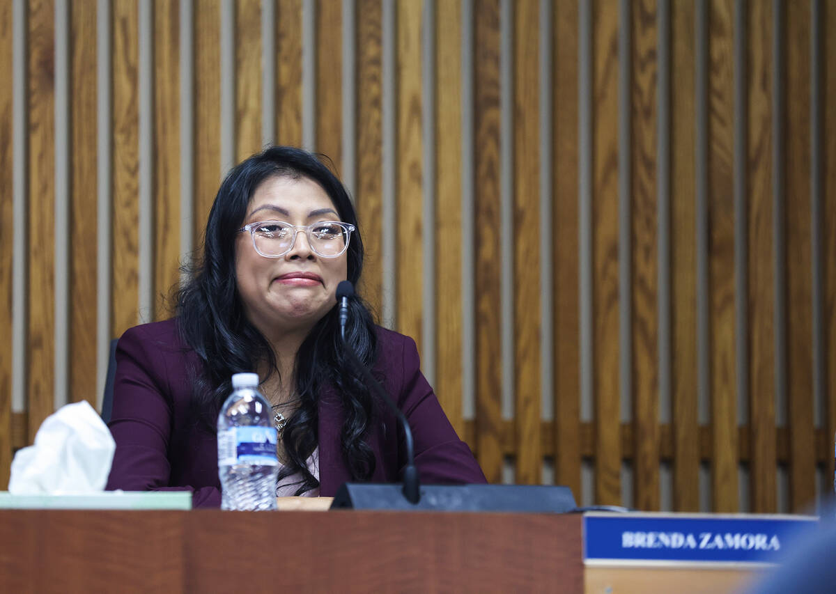Brenda Zamora, newly elected school board trustee for District D, reacts emotionally as a speak ...