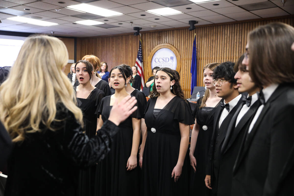 Students from Las Vegas Academy sing The Star Spangled Banner at a special school board meeting ...
