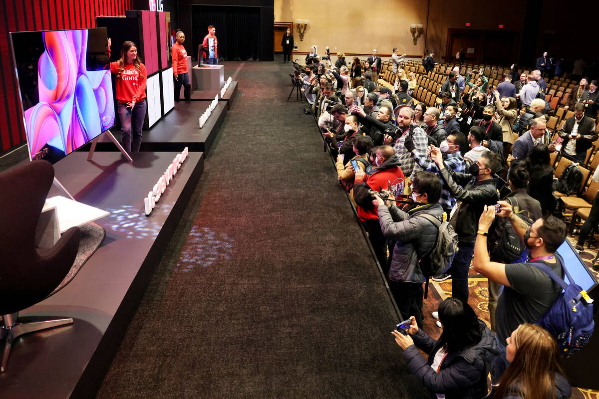 Members of the news media attend the LG Electronics press conference ahead of CES at Mandalay B ...