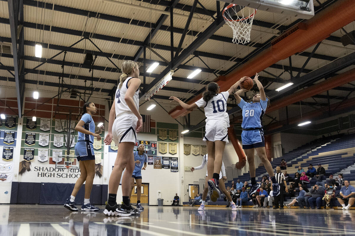 Shadow Ridge’s Jaslyn Jefferson (10) thwarts a shot by Centennial’s Nivea Campbel ...