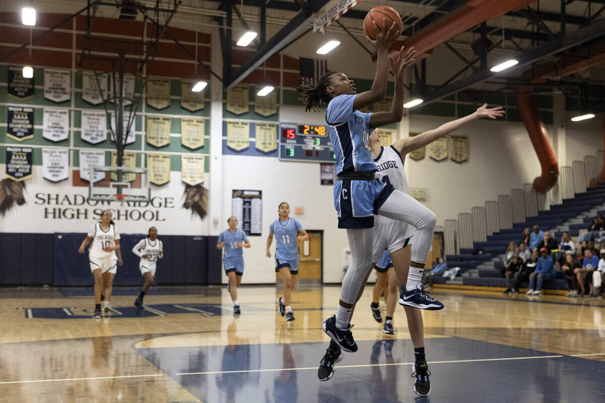 Centennial’s Kaniya Boyd (00) shoots against Shadow Ridge’s Kelly Megown (4) duri ...