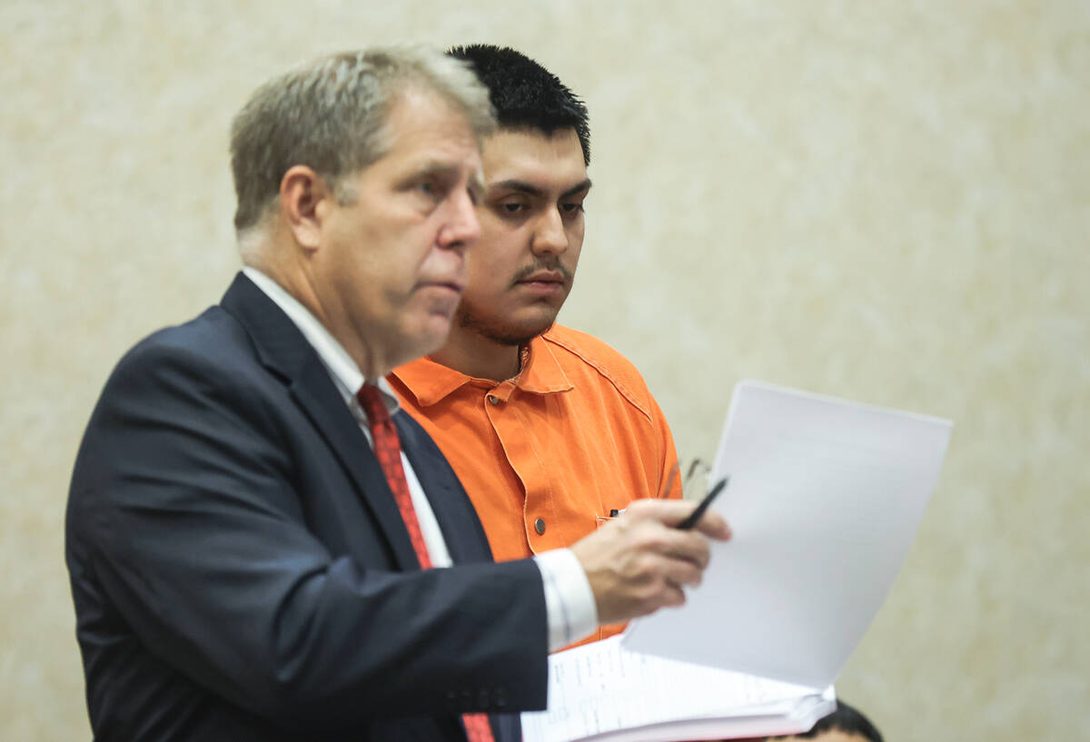 Defense attorney Craig Mueller addresses the court next to his client Fernando Reyes, who alleg ...