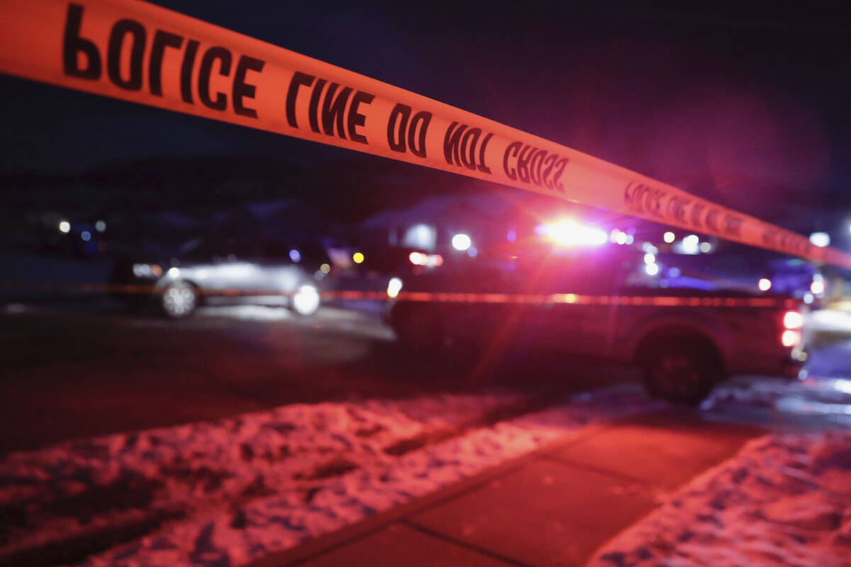 Police tape surrounds the crime scene in Enoch, Utah, where eight members of a family were foun ...