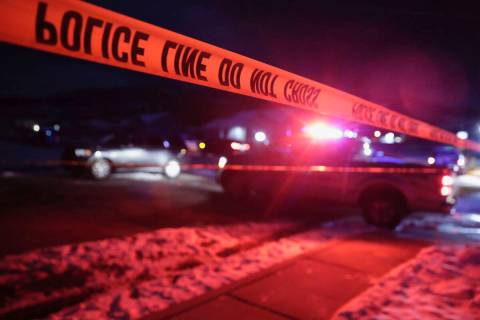 Police tape surrounds the crime scene in Enoch, Utah, where eight members of a family were foun ...