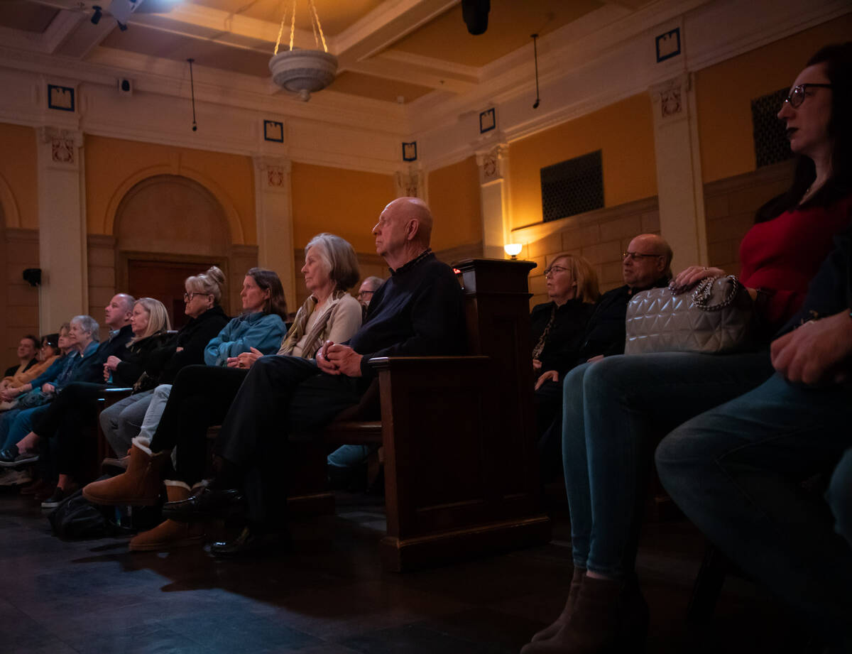 Audience members listen to speakers at a panel discussion of the 40th anniversary of the Jimmy ...