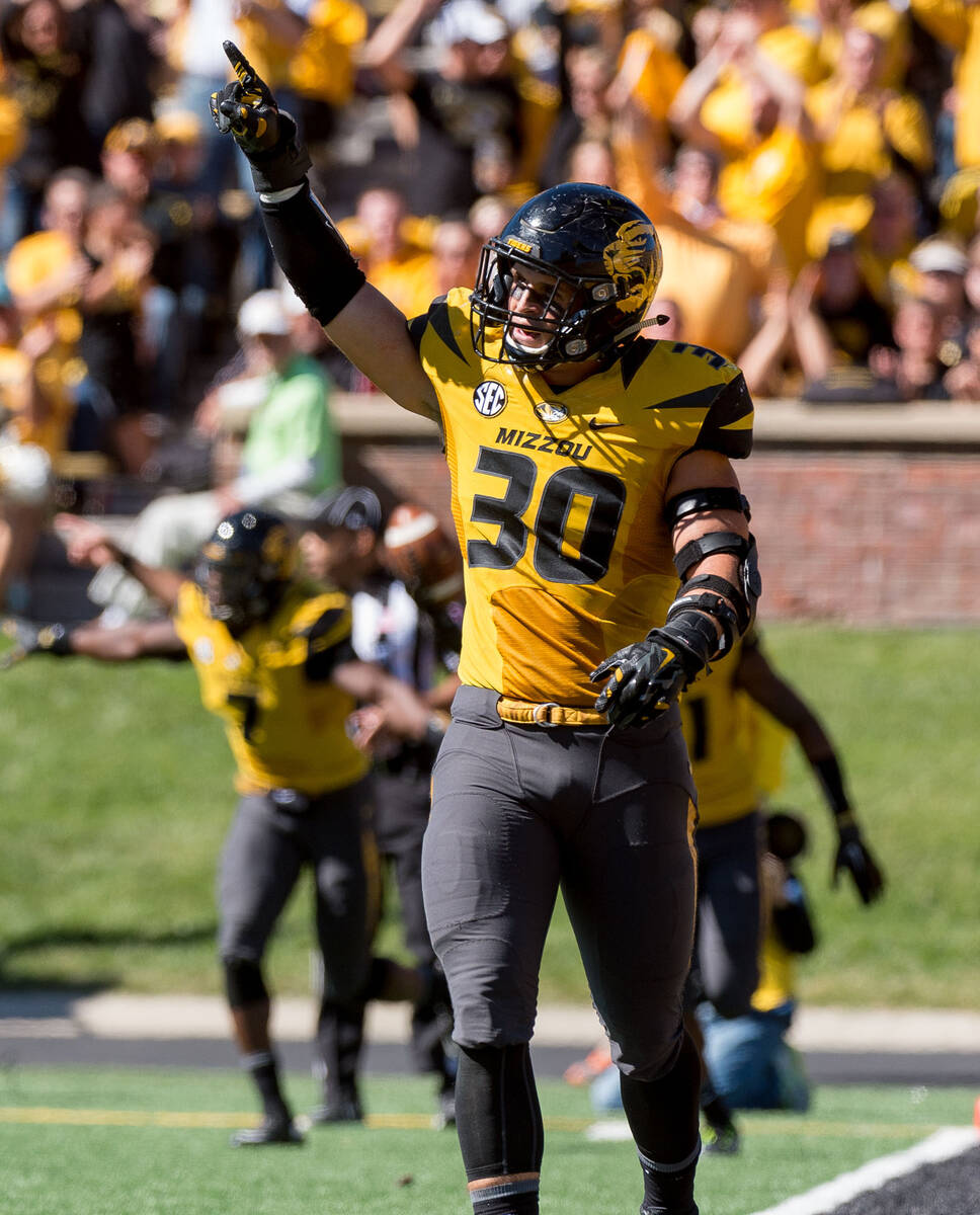 Missouri linebacker Michael Scherer celebrates after his team intercepted the ball during the t ...