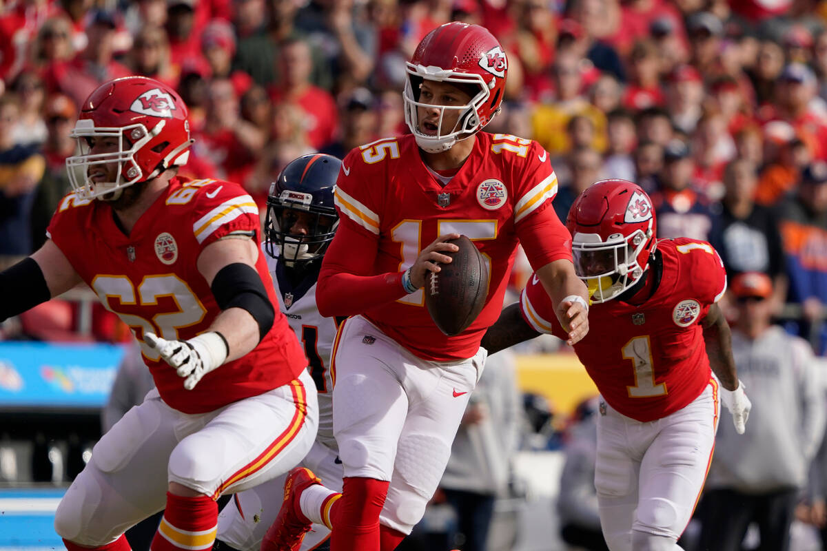 Kansas City Chiefs quarterback Patrick Mahomes looks to pass against the Denver Broncos during ...