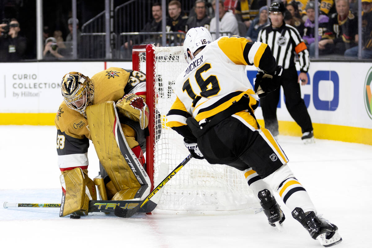 Vegas Golden Knights goaltender Adin Hill (33) makes a save against Pittsburgh Penguins left wi ...