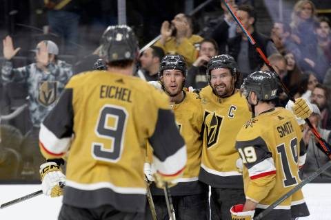 Vegas Golden Knights right wing Mark Stone, second from right, celebrates his goal with center ...