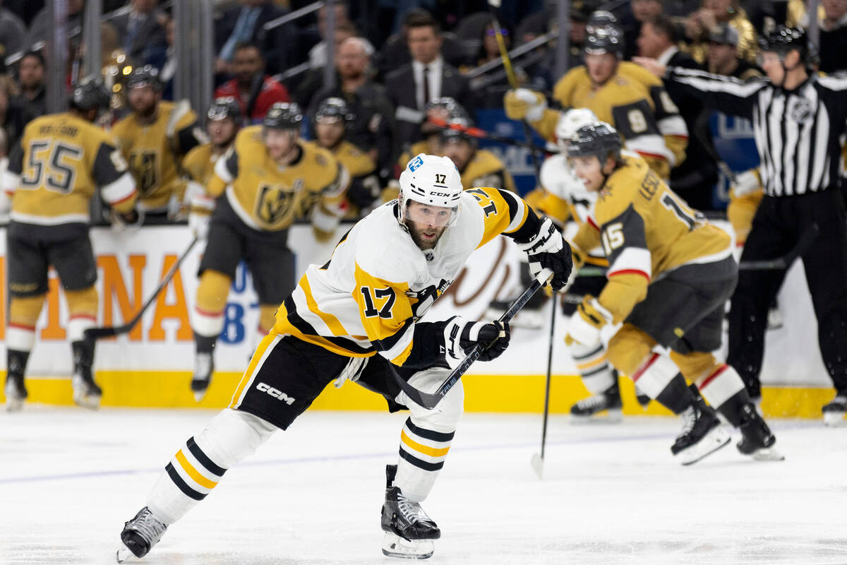 Pittsburgh Penguins right wing Bryan Rust (17) skates up the ice during the third period of the ...