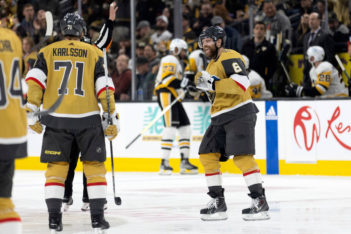 Vegas Golden Knights center Phil Kessel (8) celebrates with teammates, including center William ...