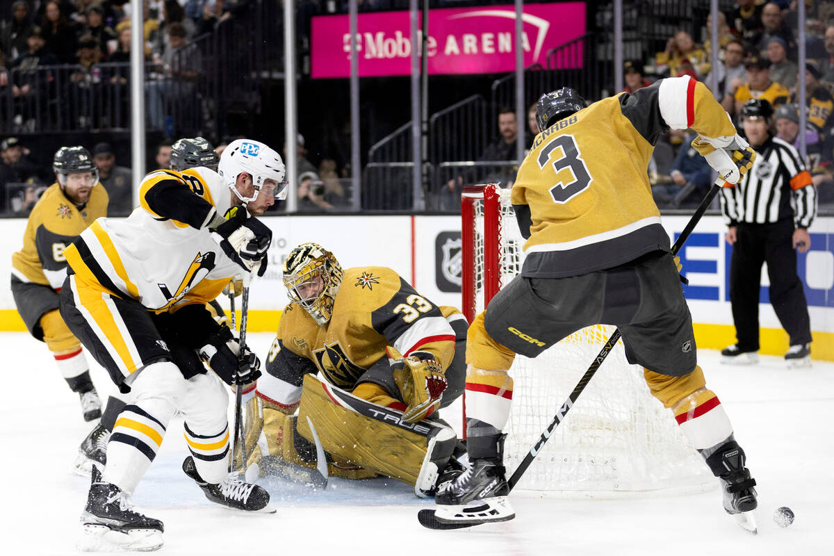 Vegas Golden Knights goaltender Adin Hill (33) makes a save on Pittsburgh Penguins defenseman B ...