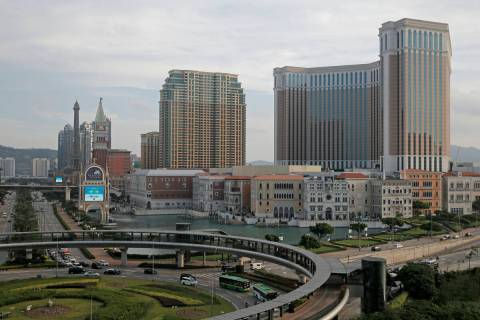 The Venetian Macao casino resorts stand at the Cotai Strip in Macao on June 3, 2018. (AP Photo/ ...