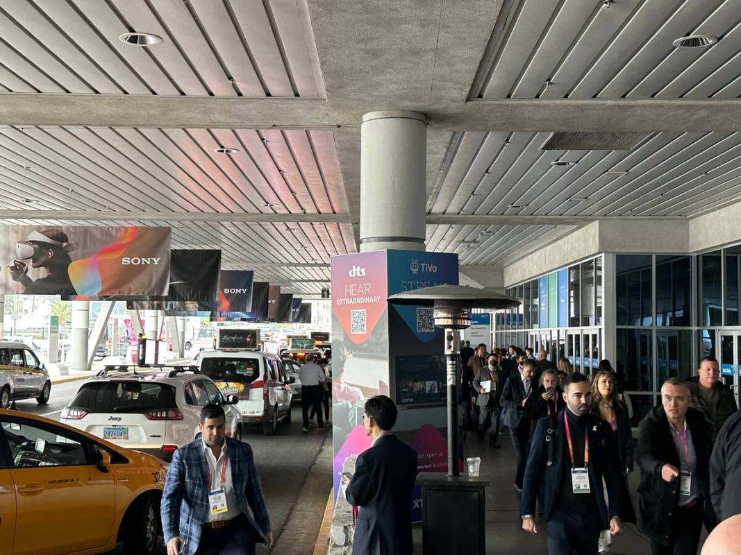 CES attendees at the bus staging area of central hall at the Las Vegas Convention Center on Thu ...