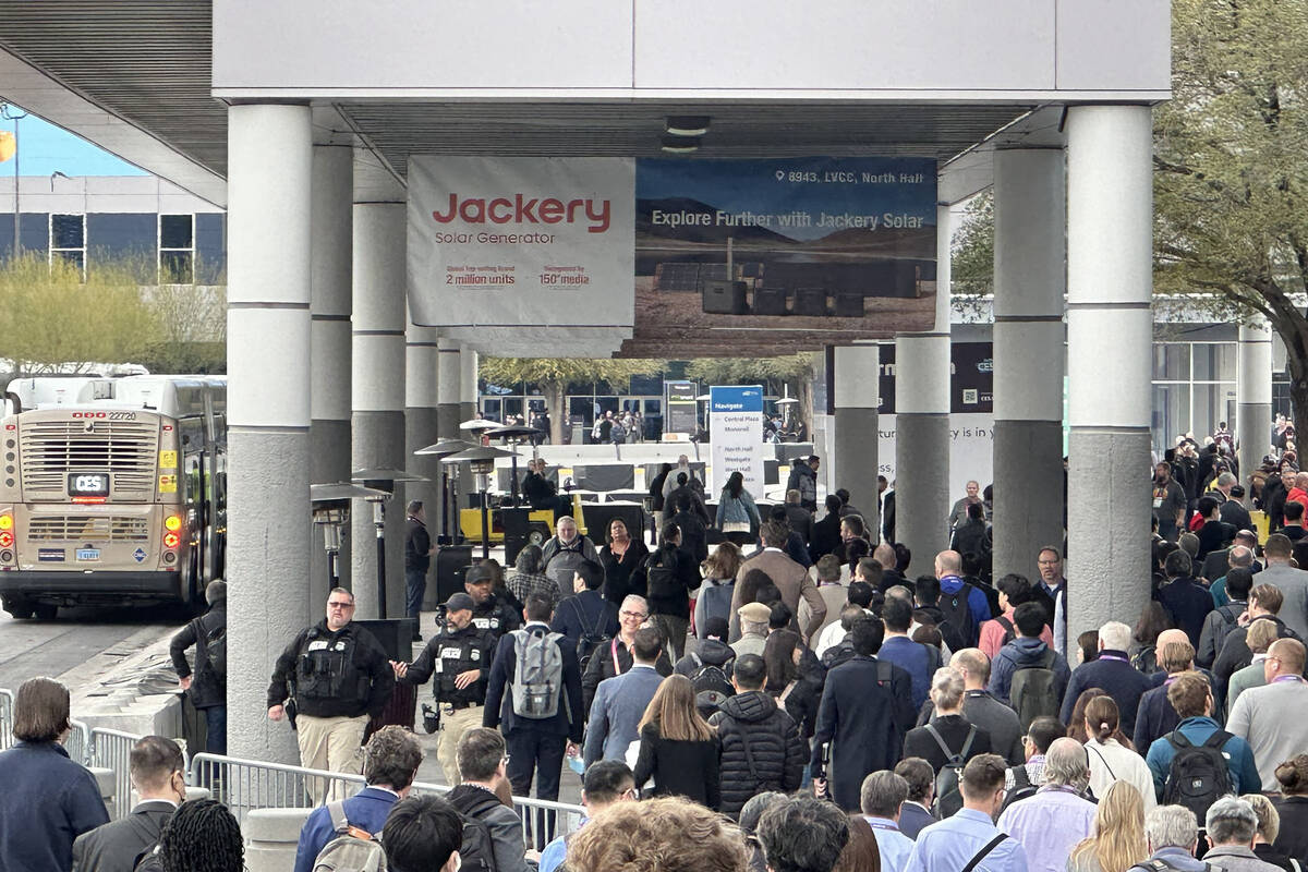 CES attendees at the taxi staging area of north hall at the Las Vegas Convention Center on Thur ...