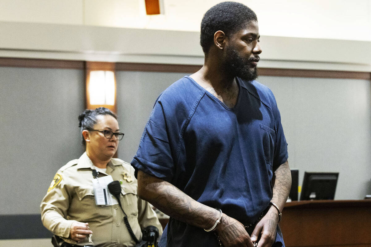 Marcus Maddox is led into the courtroom at the Regional Justice Center where he was scheduled t ...