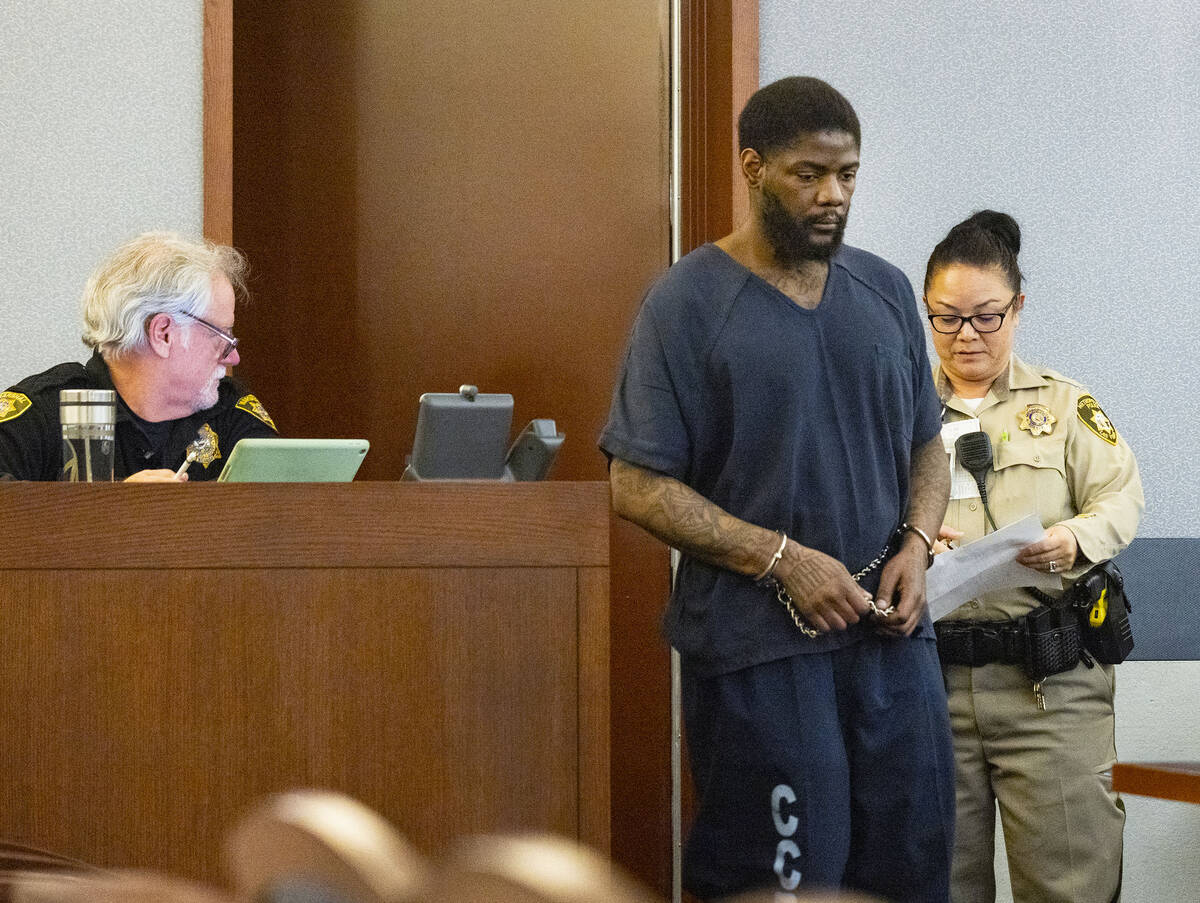 Marcus Maddox is led into the courtroom at the Regional Justice Center where he was scheduled t ...