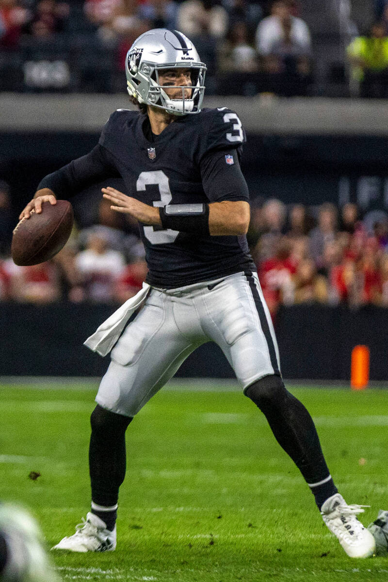 Raiders quarterback Jarrett Stidham (3) throws during the first half of an NFL game against the ...
