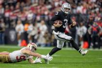Raiders quarterback Jarrett Stidham (3) scrambles as San Francisco 49ers defensive end Nick Bos ...