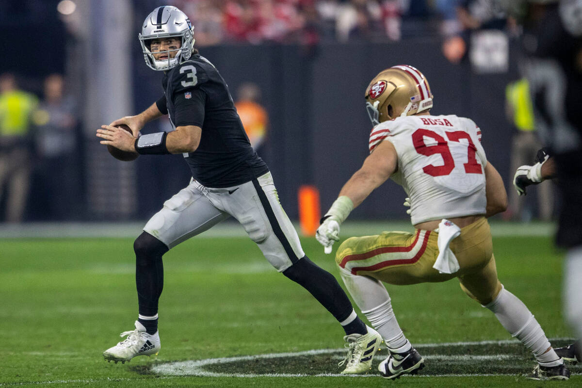 Raiders quarterback Jarrett Stidham (3) looks to throw with San Francisco 49ers defensive end N ...