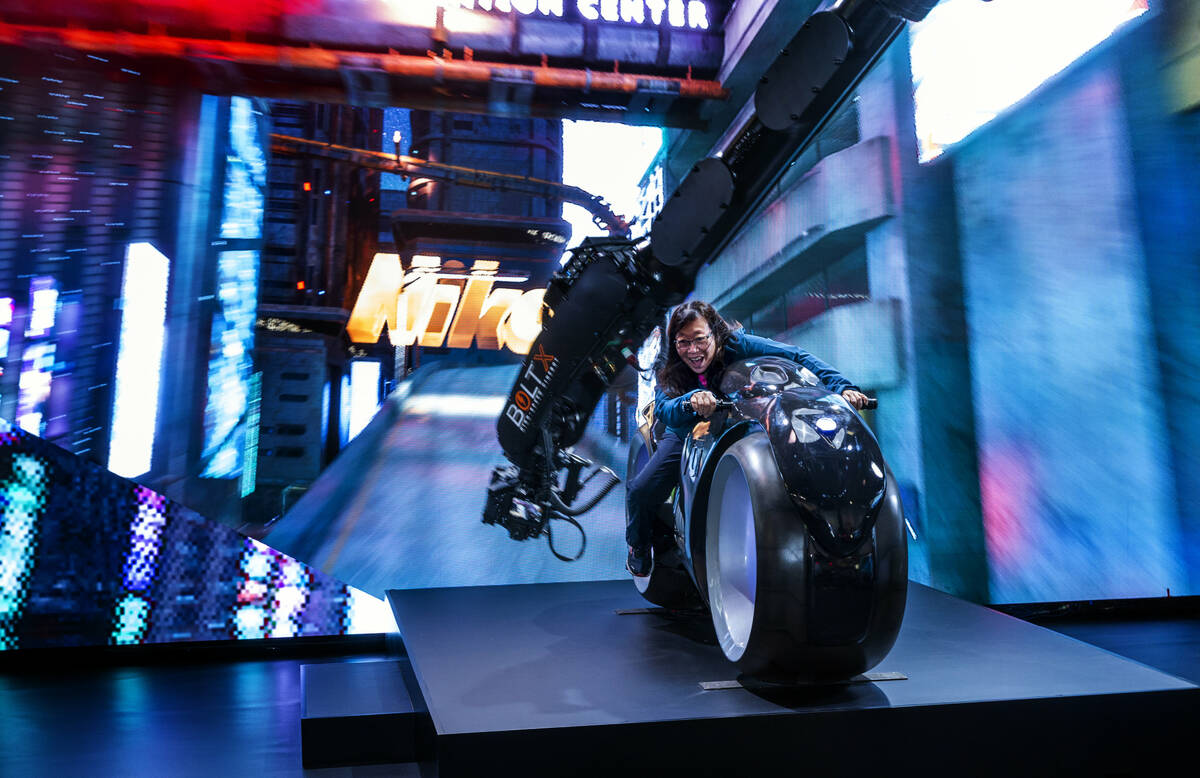 Attendee Maureen Chun sits atop a stagnant motorcycle while filmed by the Nikon Z9 at their Unr ...