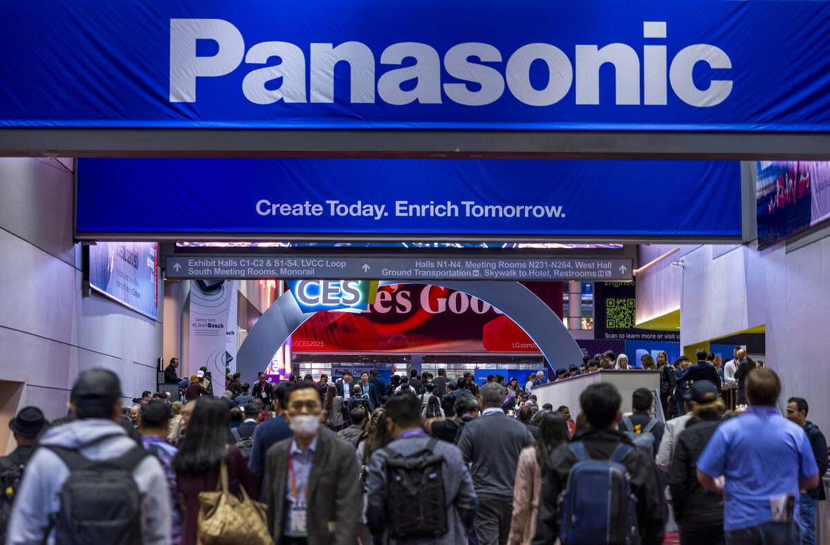 Attendees wander between the north and central halls during the opening day of CES 2023 at the ...