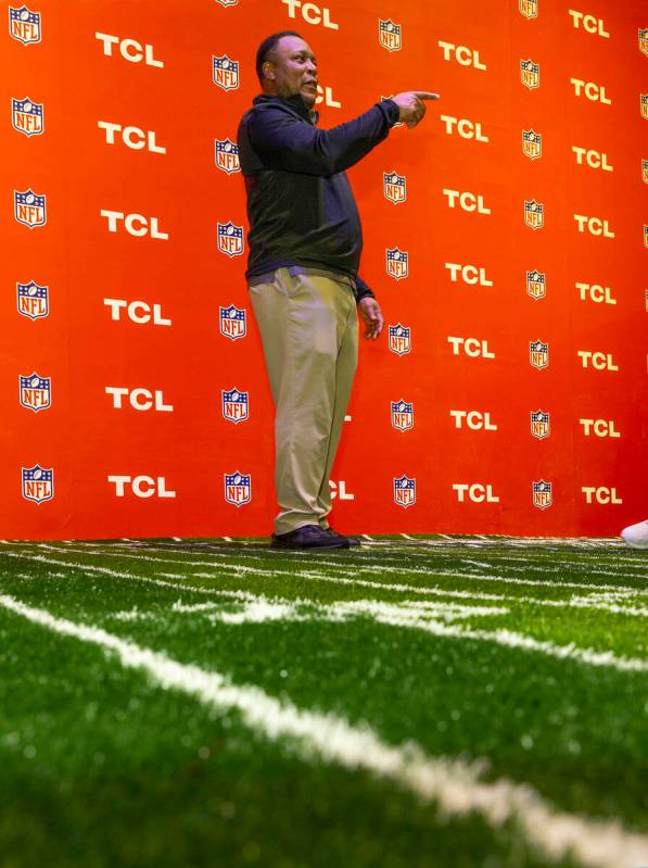 NFL Football legend Barry Sanders awaits the next attendee at a meet-and-greet sponsored by TCL ...