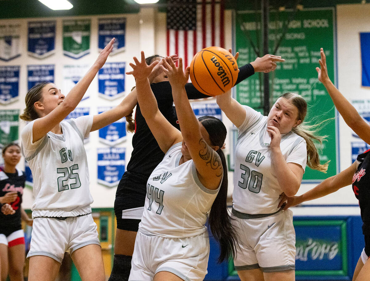 Green Valley High's Amelia Rawhouser (30) Kyra Willey (25) Saedy Cozo (44) and Liberty High's A ...