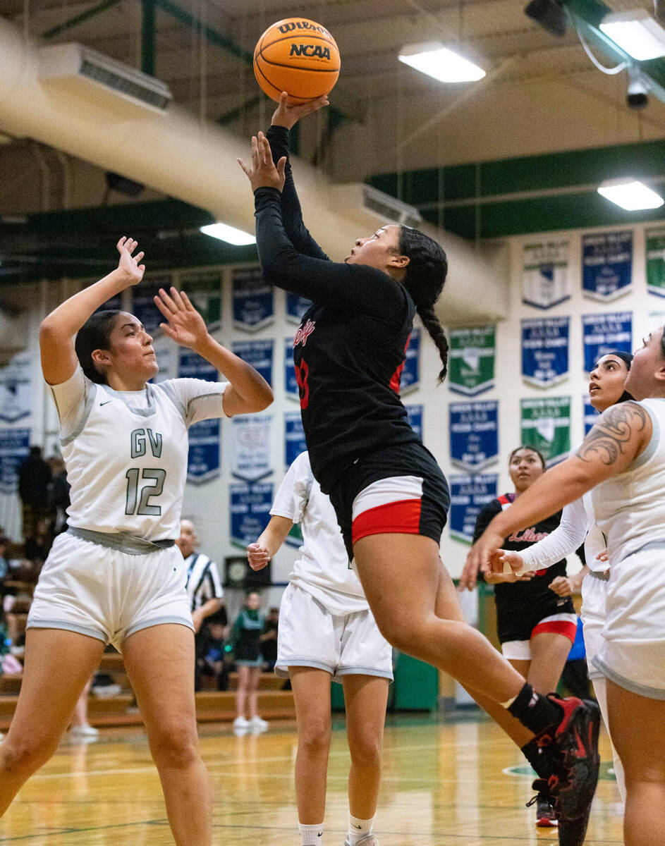 Liberty High's Payton Gates (20) shoots over Green Valley's Lily Rodriguez (12) during the firs ...