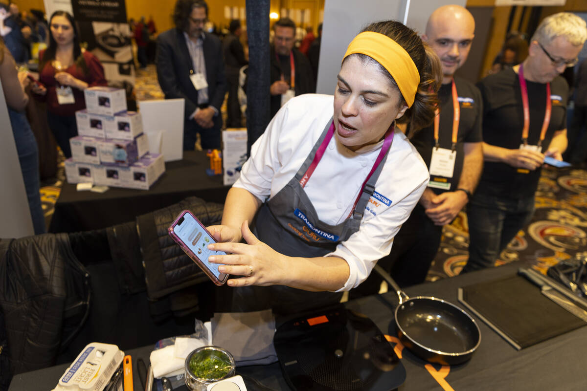 Chef Flavia Gols gives a demonstration of the Tramontina Guru cooktop during the CES ShowStopp ...