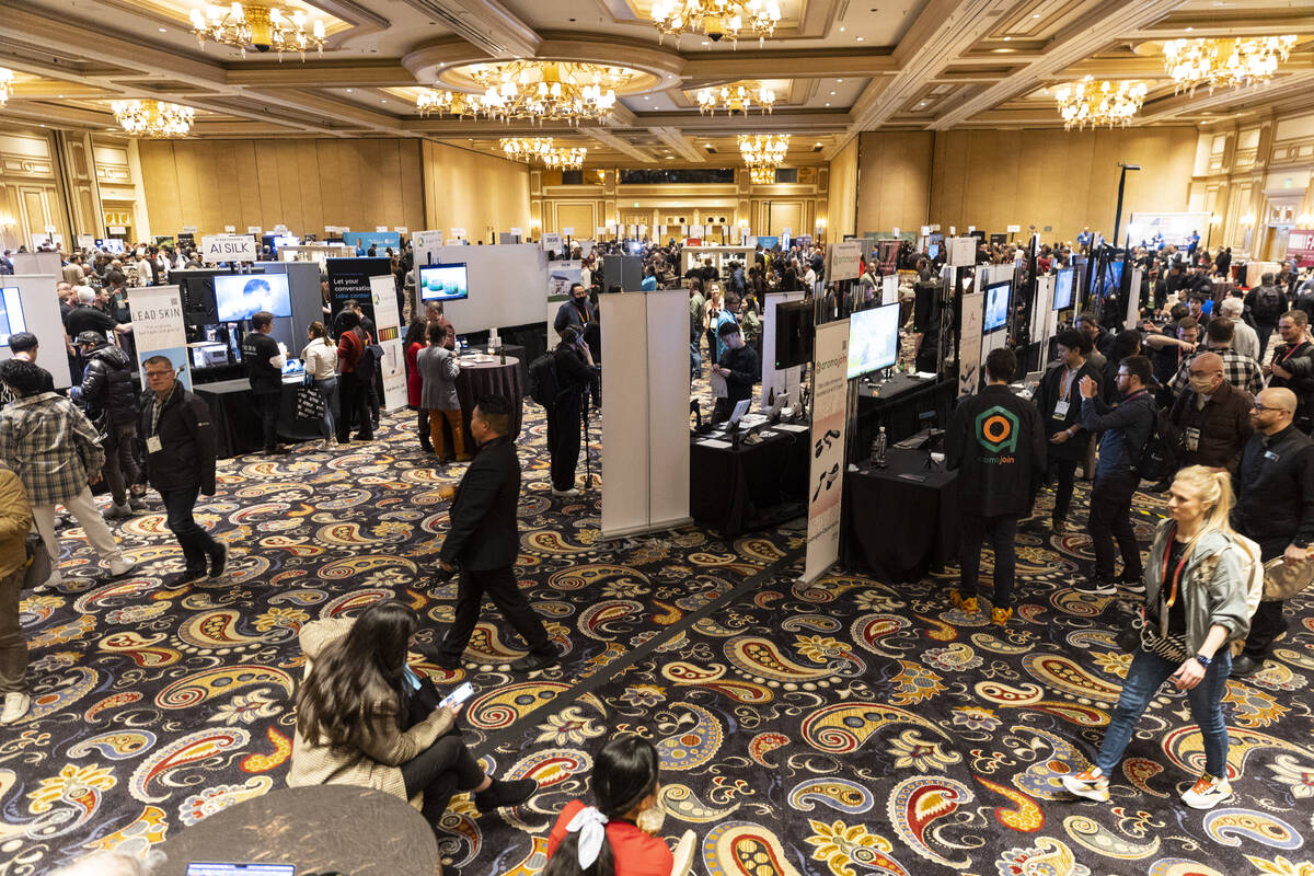 People attend CES ShowStoppers event at the Bellagio hotel-casino in Las Vegas, Thursday, Jan. ...