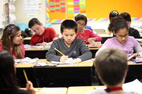 Students work in aportable classroom at Robert L. Forbuss Elementary School in Las Vegas in thi ...