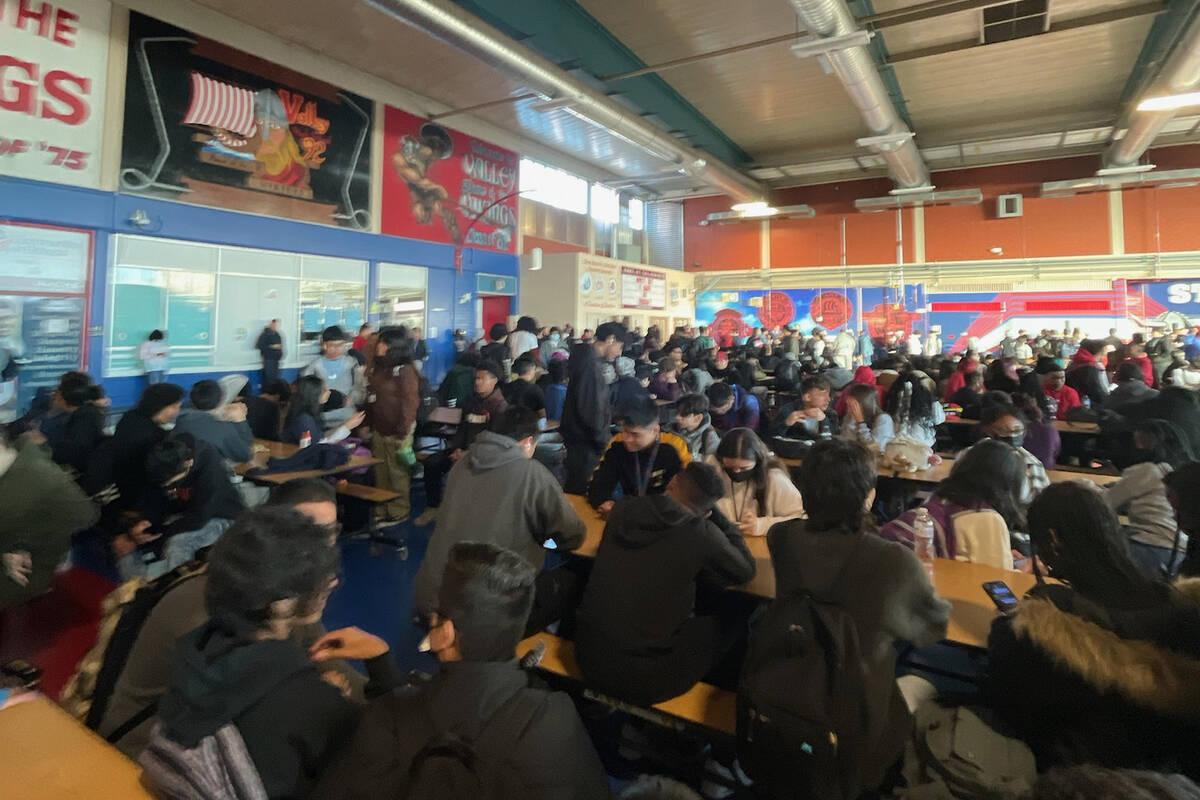 Valley High School students gather in the school's cafeteria during a power outage on Friday, J ...