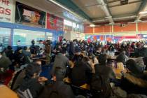 Valley High School students gather in the school's cafeteria during a power outage on Friday, J ...
