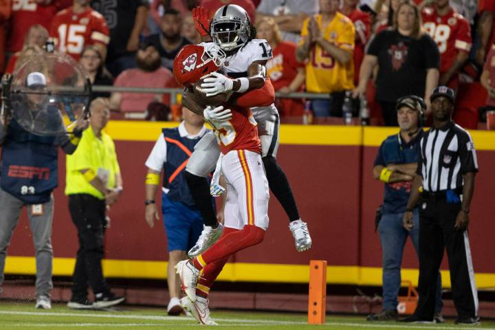 Raiders wide receiver Davante Adams (17) can’t haul in a catch with Kansas City Chiefs c ...