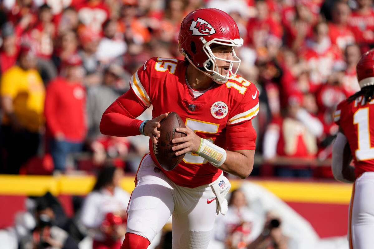 Kansas City Chiefs quarterback Patrick Mahomes looks to pass against the Denver Broncos during ...