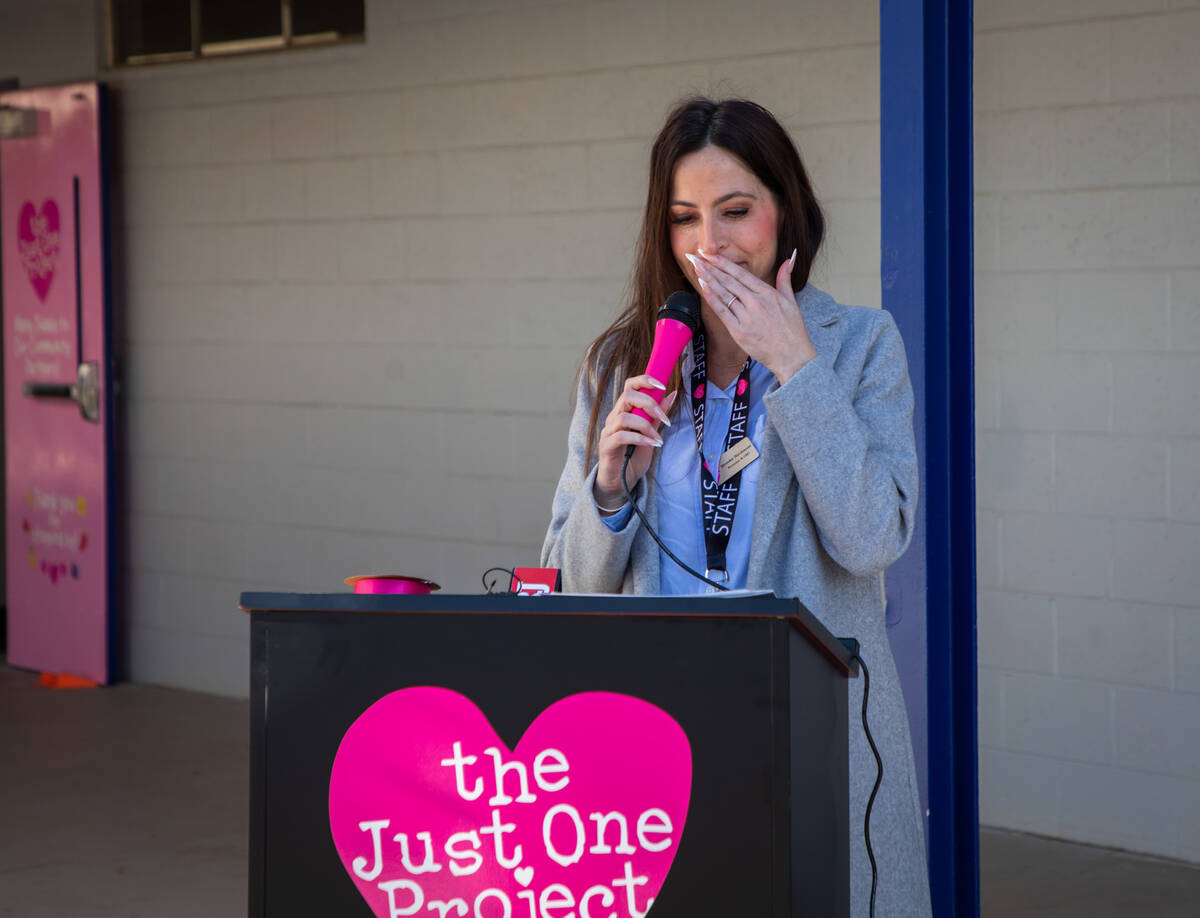 Brooke Neubauer, left, founder and CEO of The Just One Project, becomes emotional while speakin ...