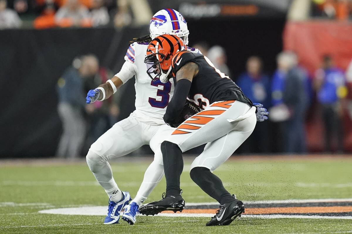 Cincinnati Bengals wide receiver Tee Higgins (85) runs near Buffalo Bills safety Damar Hamlin ( ...