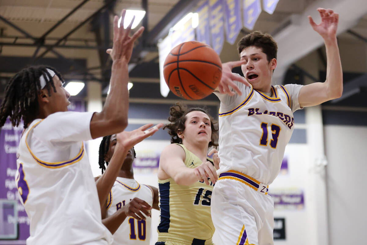 Durango's Colton Knoll (13) reaches for a loose ball under pressure from Foothill's Caleb Rhea ...