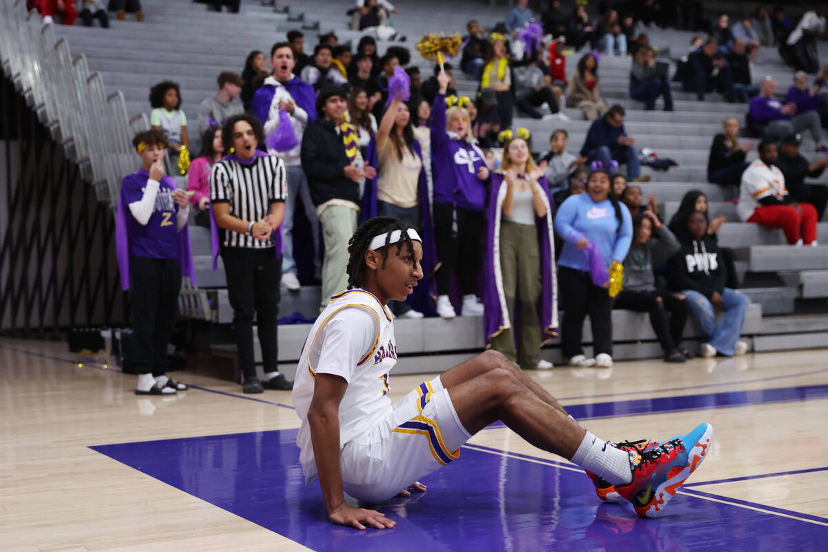 Durango's Jevon Yapi (3) takes a fall after scoring during a boy's basketball game against Foot ...