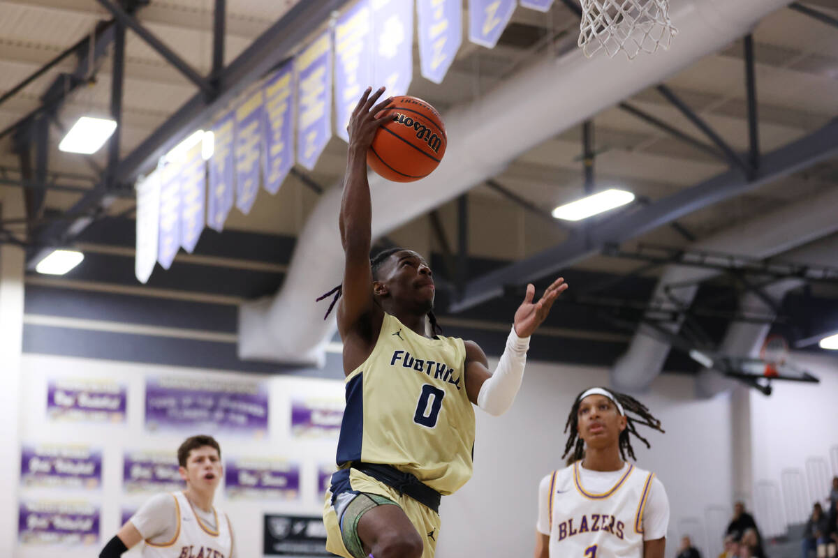 Foothill's Jay Haylock (0) takes a shot during a boy's basketball game against Durango at Duran ...
