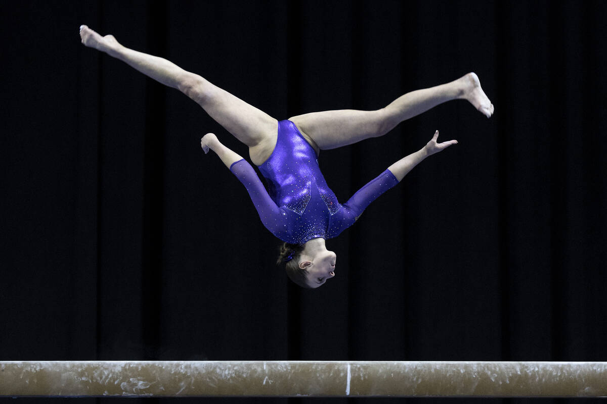 Washington’s Morgan Bowles competes in balance beam during session one of the Super 16 Gymnas ...