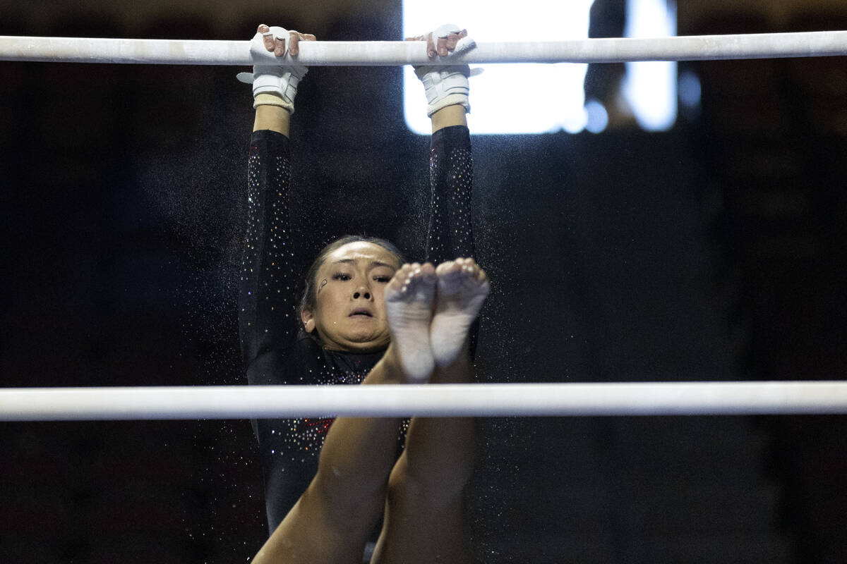 Shylen Murakami, Southern Utah University, competes in uneven bars during session one of the Su ...